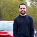 Marcus T. standing next to his tuned car